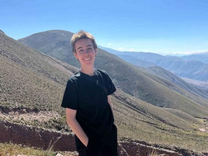 Rutgers alum Jay Schroepfer stands before a mountain vista in the province of Jujuy in northwest Argentina in April.