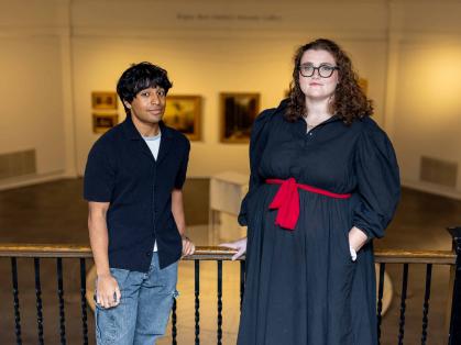 Rutgers students Roshan Kenath (left) and Megan Mauriello stand in the Art of the Americas Gallery at the Zimmerli Art Museum.