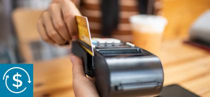 A student swipes a credit card to buy a coffee