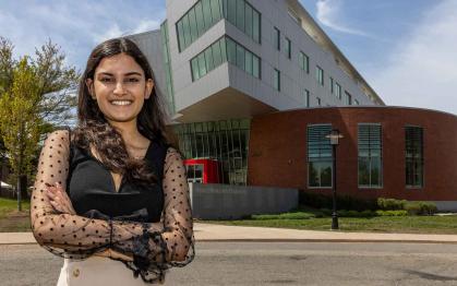Rutgers-New Brunswick student Asmi Kaushal poses outside the Richard Weeks Hall of Engineering.