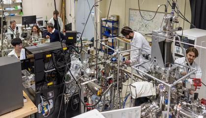 Scientists work on a physics experiment in a lab