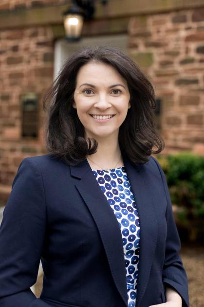 Francine Glaser smiles and stands outside Old Queens at Rutgers-New Brunswick..