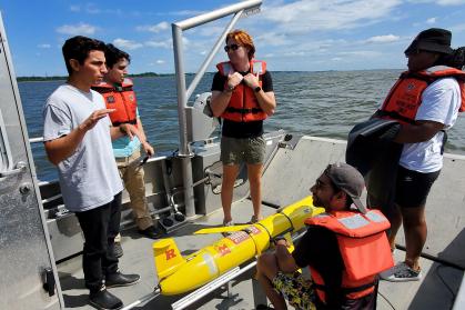 Joe Gradone on a boat working with a glider