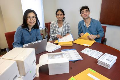 Students assemble and prepare distribution of home stool test kits at the Eric B. Chandler Health Center