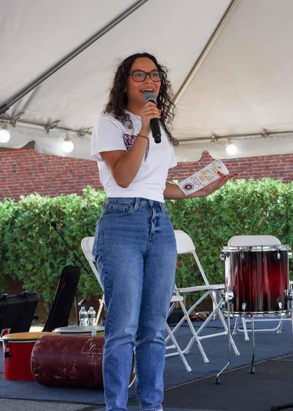 Alejandra Afanador introduces herself as an RU Voting Ambassador during a registration event at the Center for Latino Arts and Culture on Sept. 22.