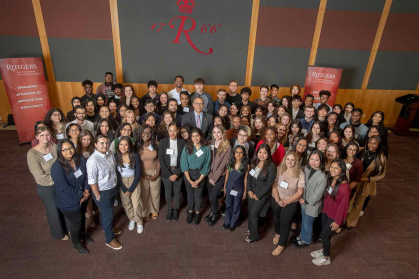 Students participating in the Rutgers Summer Service Internship program gather for a group photo during an event in May 2023 at the College Avenue Student Center.