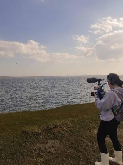 Rutgers alumni Kimberly Hansen films on location near the station in Tuckerton, N.J.