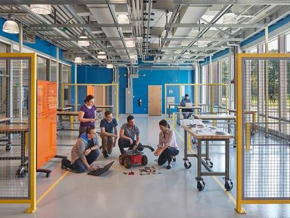 Engineering students collaborate in a modernistic classroom