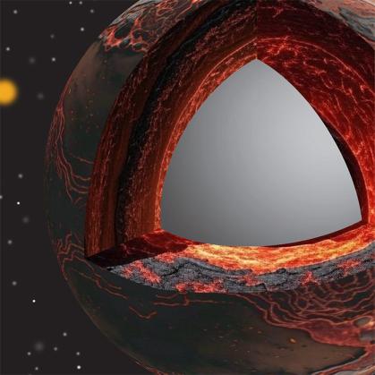 A molten lake of silver sits within a black and orange molten core.