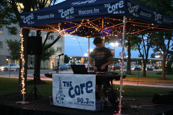 A student DJs for 90.3FM The Core at an event on Livingston campus