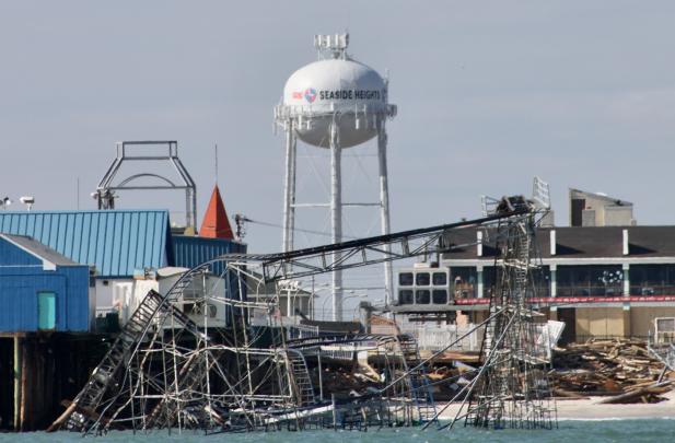 The Seaside Heights water tower is seen over the wreckage of a roller coaster after Superstorm Sandy.