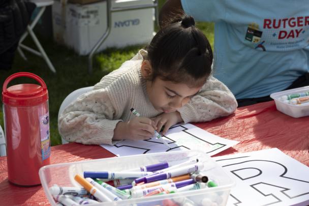 North Brunswick, N.J., resident Luciana Medina, 7, colors a Rutgers “R” at the R Garden on Voorhees Mall.