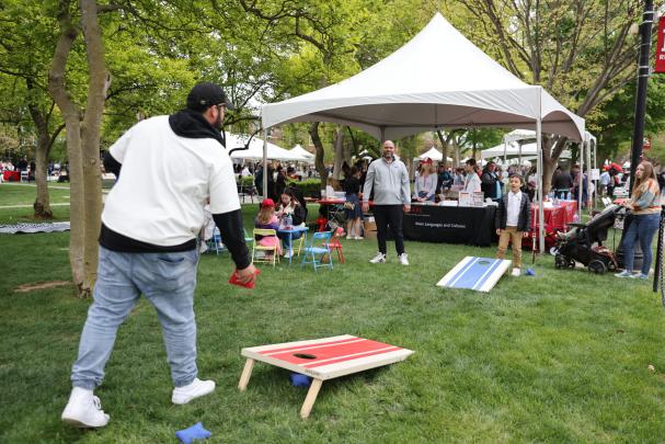 Attendees play cornhole on Rutgers Day