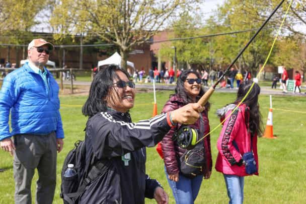 Attendees practice fly fishing on Rutgers Day