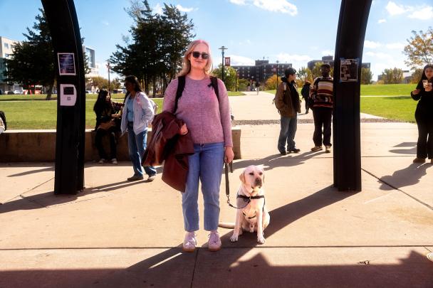 Nadia Elieff and truffle waiting at the bus stop